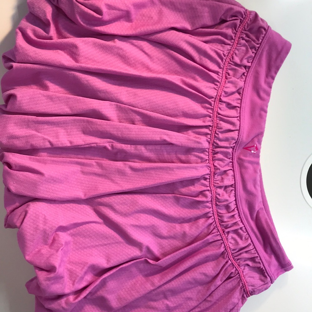 This is a pink/magenta Ivivva skirt. No stains no stretches basically brand new.